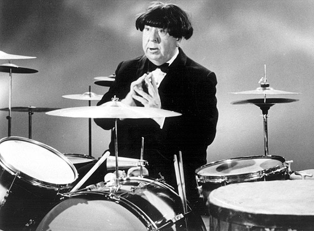 Alfred Hitchcock wearing a Beatle wig, 1964.jpg