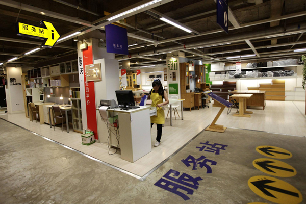 2 employee-works-at-a-service-station-at-the-11-furniture-store-in-kunming-southwest-chinas-yunnan-province.jpg