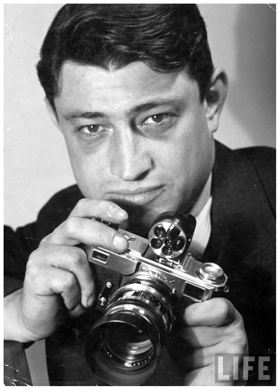 portrat-of-life-photographer-carl-mydans-w-camera-in-hand_bernard-hoffman-1937.jpeg