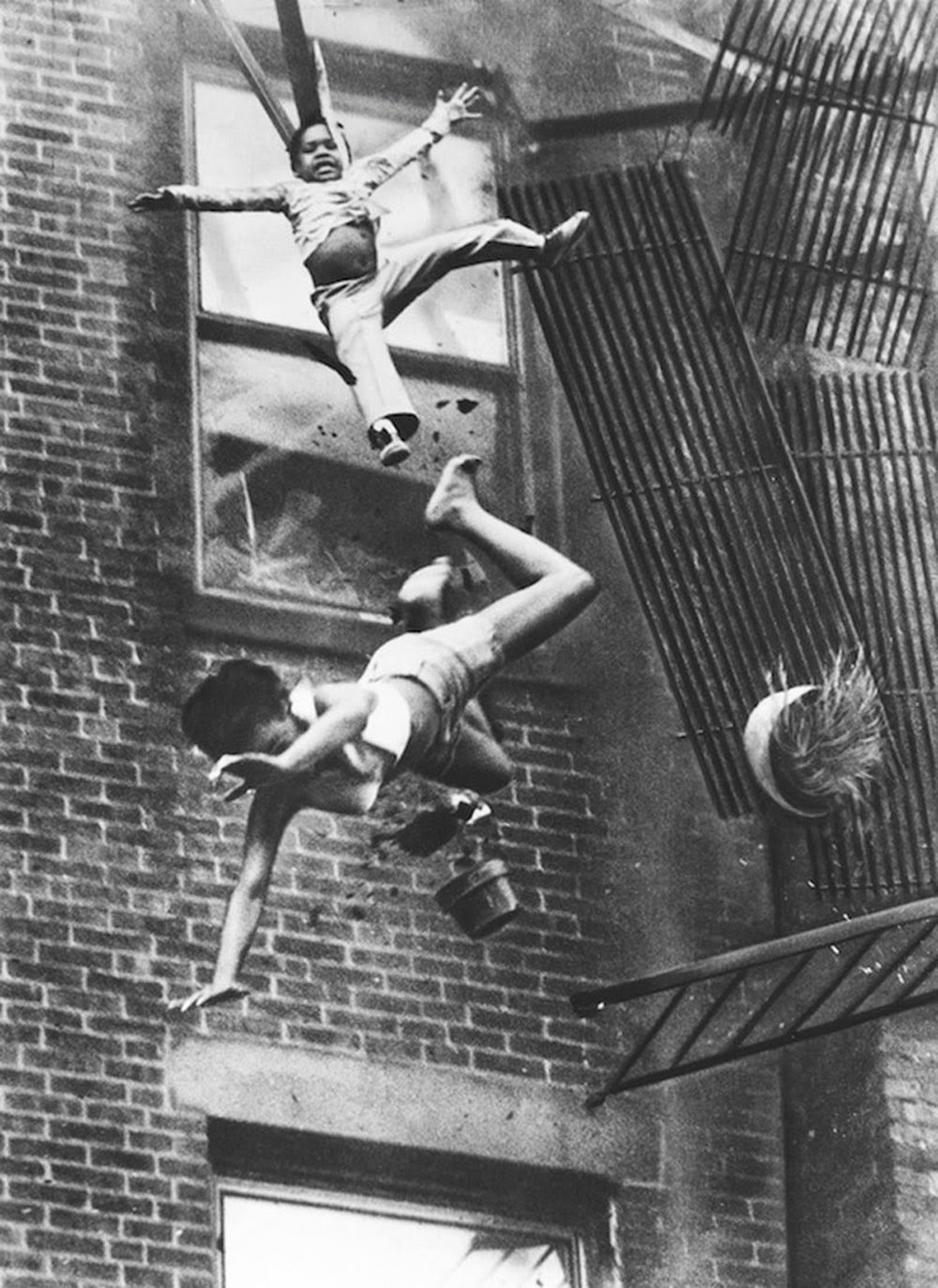 a_mother_and_her_daughter_falling_from_a_fire_escape_1975_1.jpg