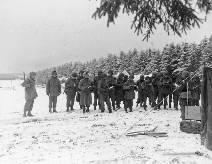 New Year's Eve Men of the 99th Inf Div listen to a Christian service.jpg